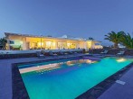 Villa and pool at night